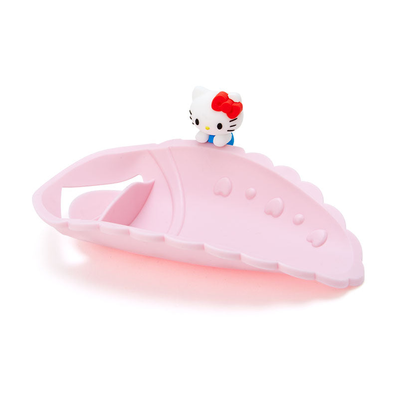 A pink Hello Kitty faucet extender with Hello Kitty's signature bow.