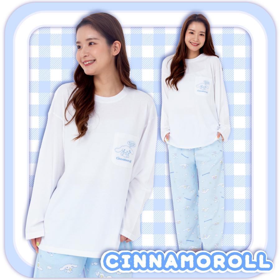 Model smiling in a Cinnamoroll long-sleeve pajama top and patterned bottoms set against a blue checkered background