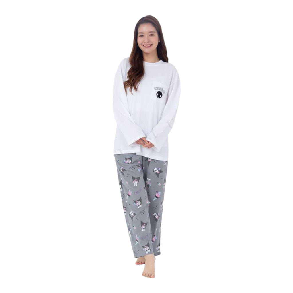 Woman smiling in a Kuromi Pajama Set with a white long-sleeved top and patterned gray pants, showcasing a relaxed and comfortable sleepwear style.
