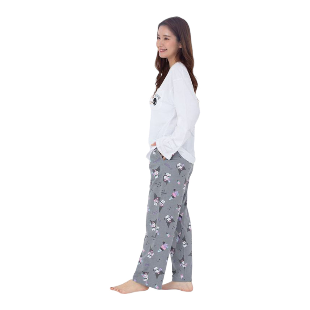 Side view of a woman wearing a white and gray Kuromi Pajama Set, with the iconic Sanrio character print on the pants.