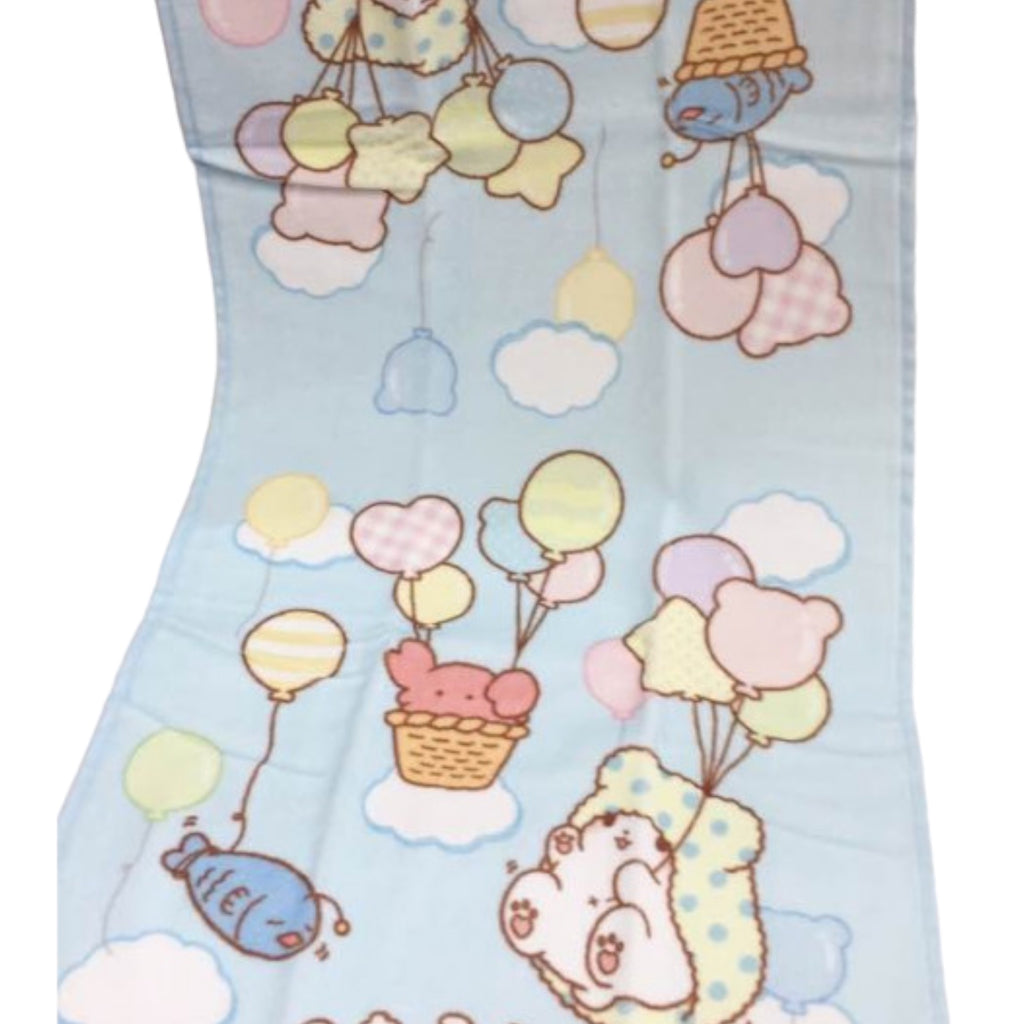 Detailed view of Sanrio Marumofubiyori Long Towel with playful illustrations of Moppu floating with balloons amidst clouds and cute weather symbols.