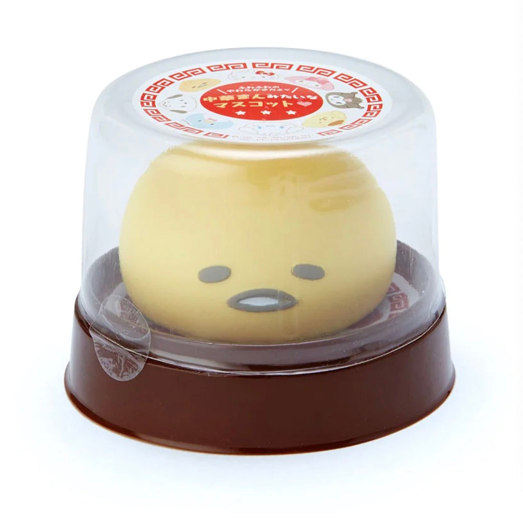 Adorable Gudetama squish toy mimicking a Chinese steamed bun, encased in a transparent container.