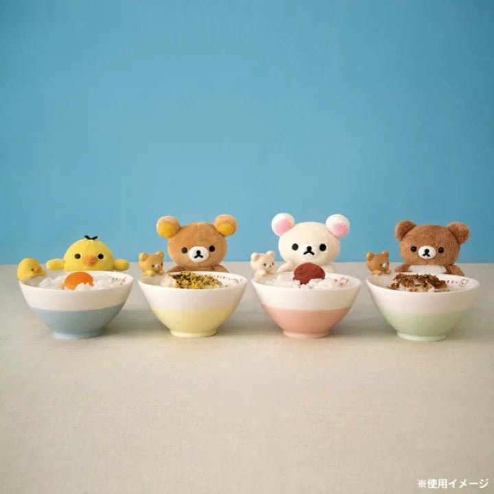 A charming collection of four San-X character bowls filled with various foods. From left to right, there's a yellow chick, a brown bear, a white bear with pink ears, and another brown bear, each accompanied by a smaller figure of the same character peeking over the rim of the bowl.
