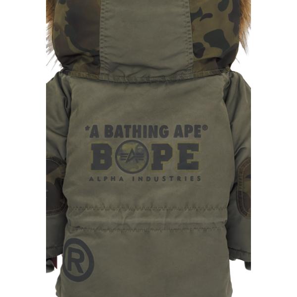 Back view of Bearbrick BAPE® × ALPHA CAMO SHARK 2023 1000% showcasing BAPE and ALPHA Industries branding