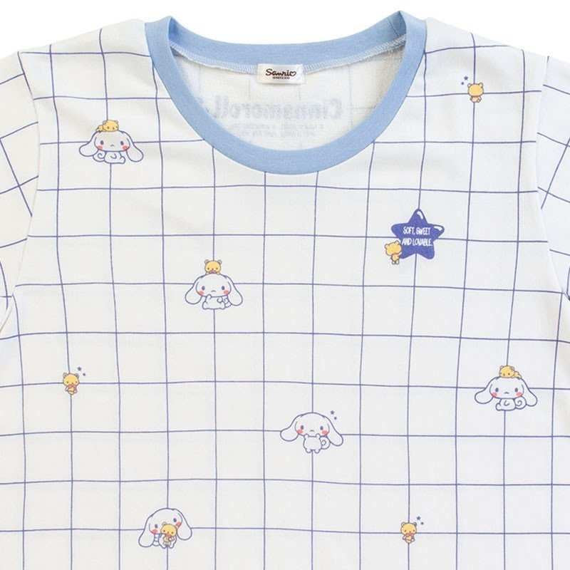 Detailed view of Sanrio Cinnamoroll Pyjama top showing 'SOFT SWEET ADORABLE' text and Cinnamoroll graphics amidst the grid design