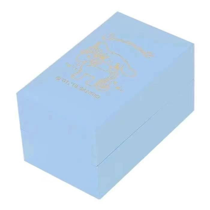 Light blue rectangular watch box with a golden Cinnamoroll unicorn silhouette for the Sanrio themed wristwatch