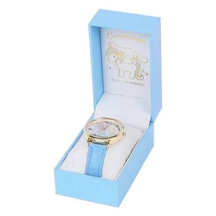 Sanrio Cinnamoroll wristwatch packaging box open to reveal the watch with a sky blue strap and unicorn face design