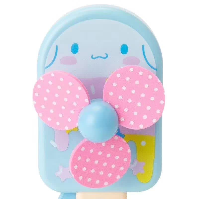 Close-up of Sanrio Cinnamoroll mini hand fan with a polka-dot design and the character's signature smile.