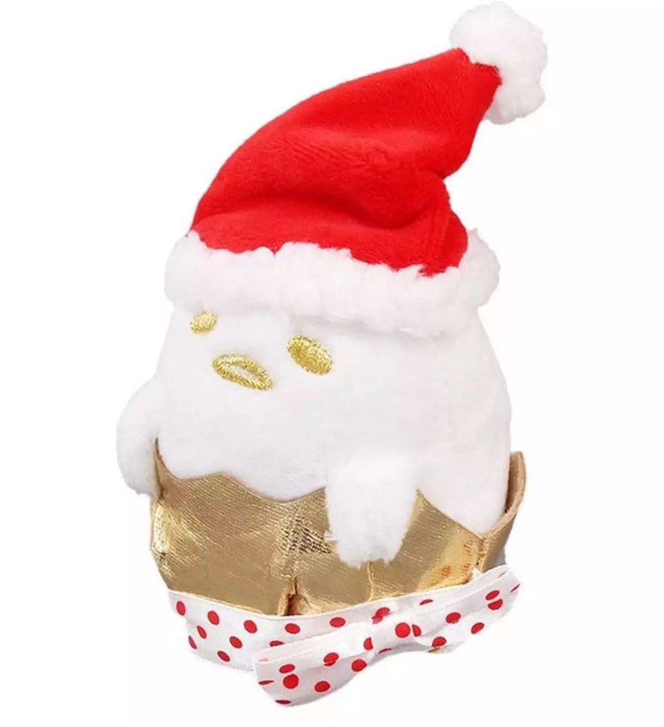 Side view of Sanrio Gudetama Christmas plush keychain with a red and white Santa hat and polka-dot trim.