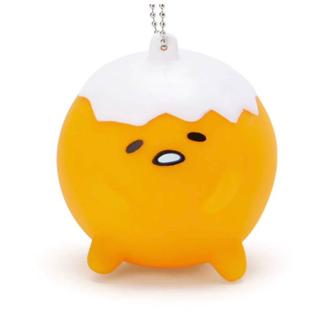 Sanrio Gudetama Whistle Mascot Holder with a white eggshell on top and a sleepy Gudetama face, attached to a silver chain.