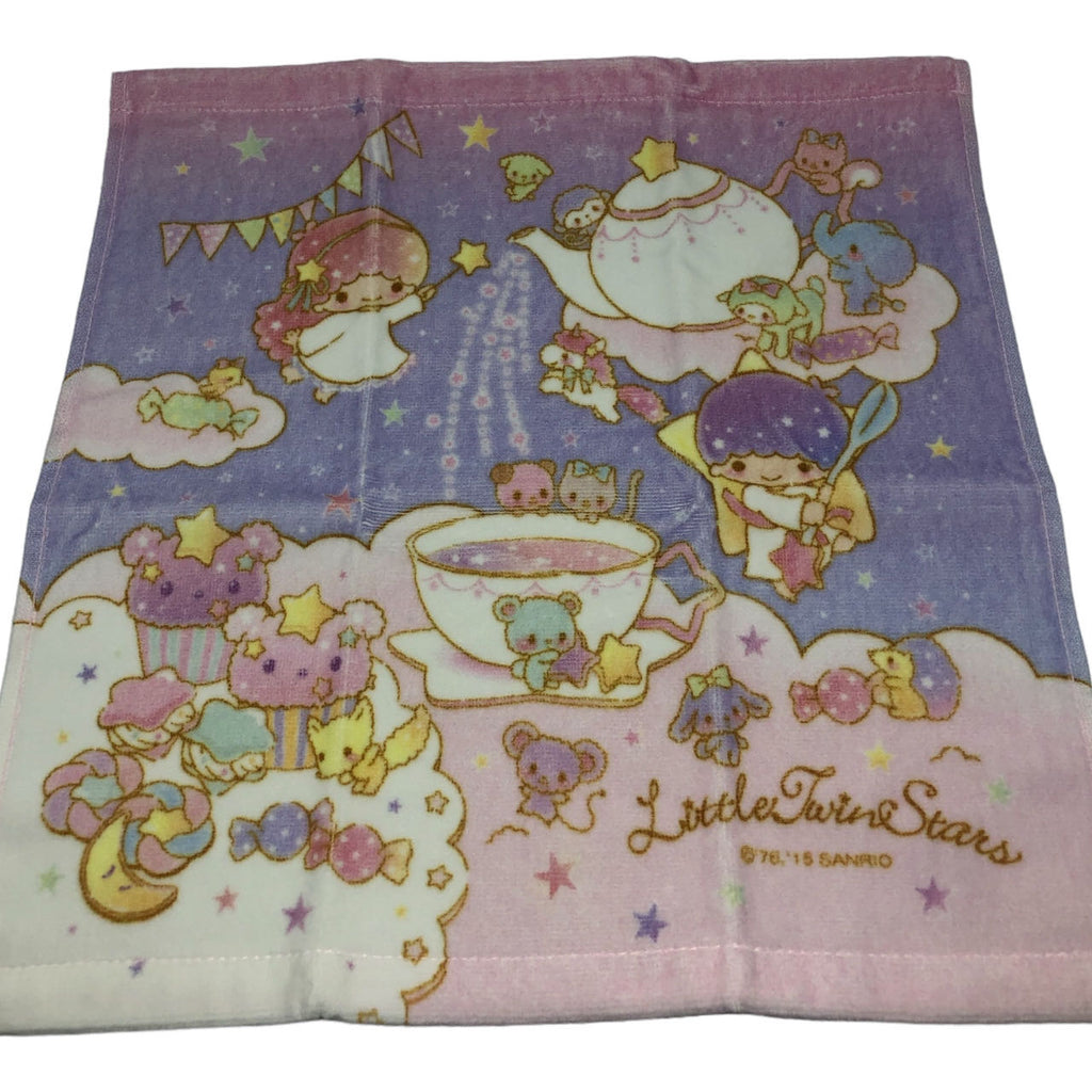 Sanrio Little Twin Stars towel depicting Kiki and Lala at a whimsical tea party with friends on a purple starry background.