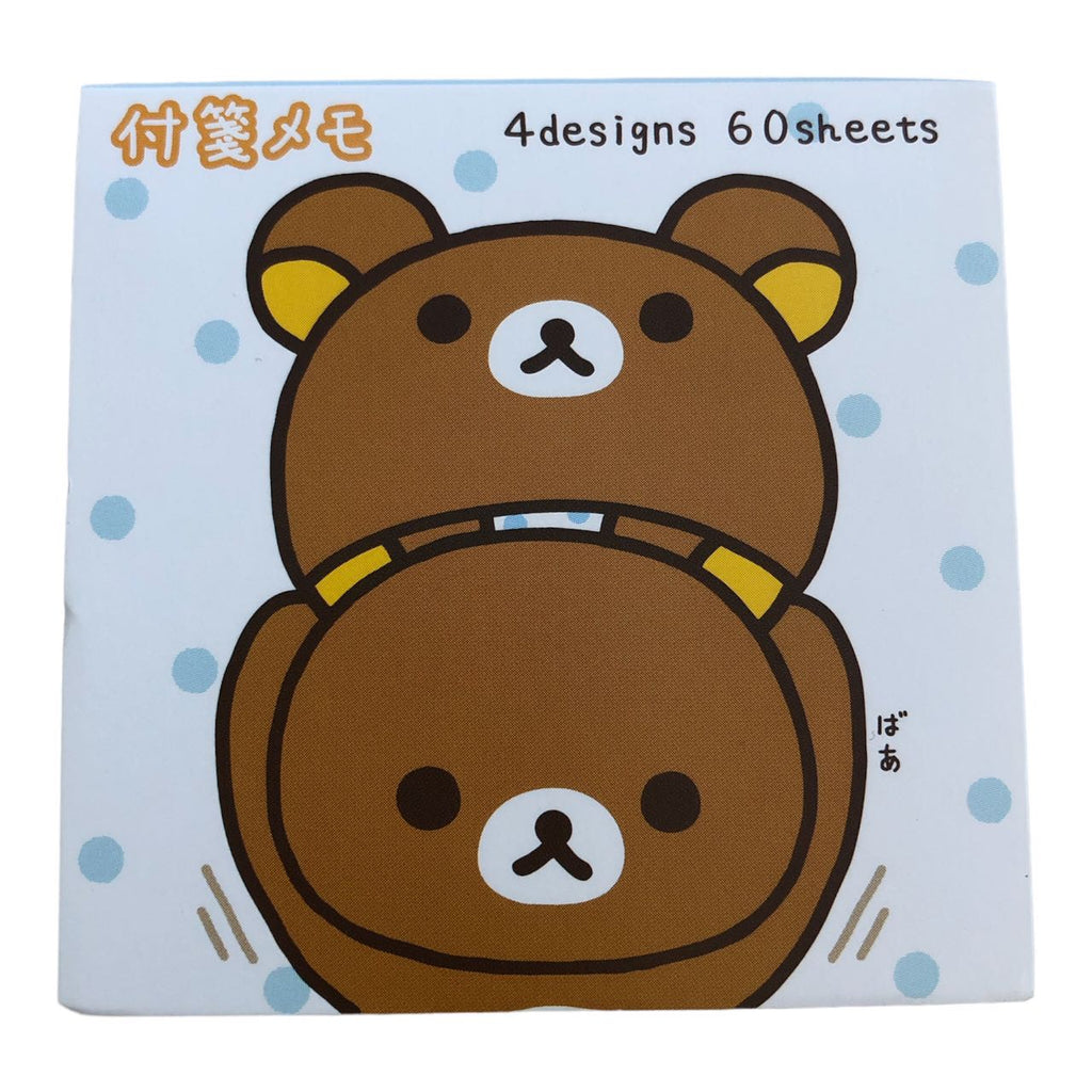Cute brown Rilakkuma bear design on a notepad cover with light blue dotted background