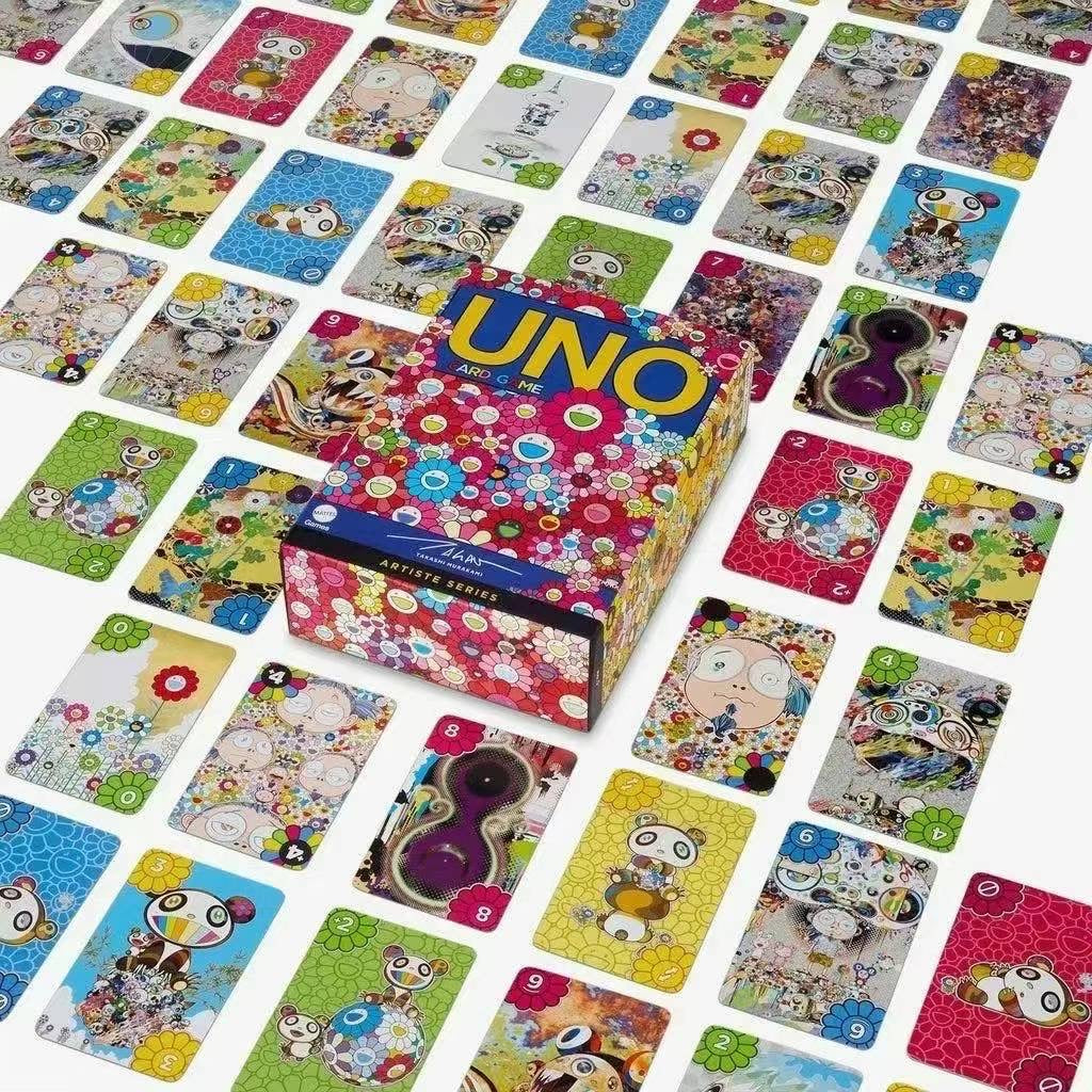 Spread of Takashi Murakami-themed UNO cards with colorful floral designs and characters, centered around a matching UNO card box.