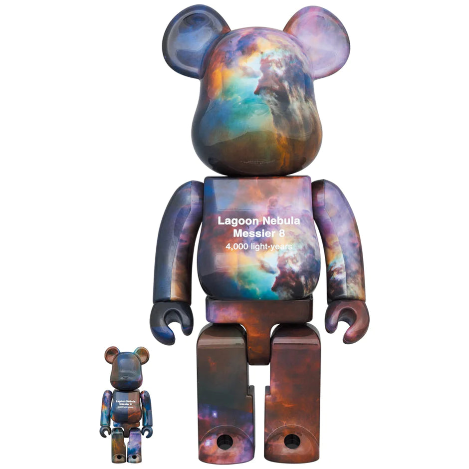 Bearbrick figures in 100% and 400% sizes, adorned with the vibrant Lagoon Nebula image from the Hubble Space Telescope