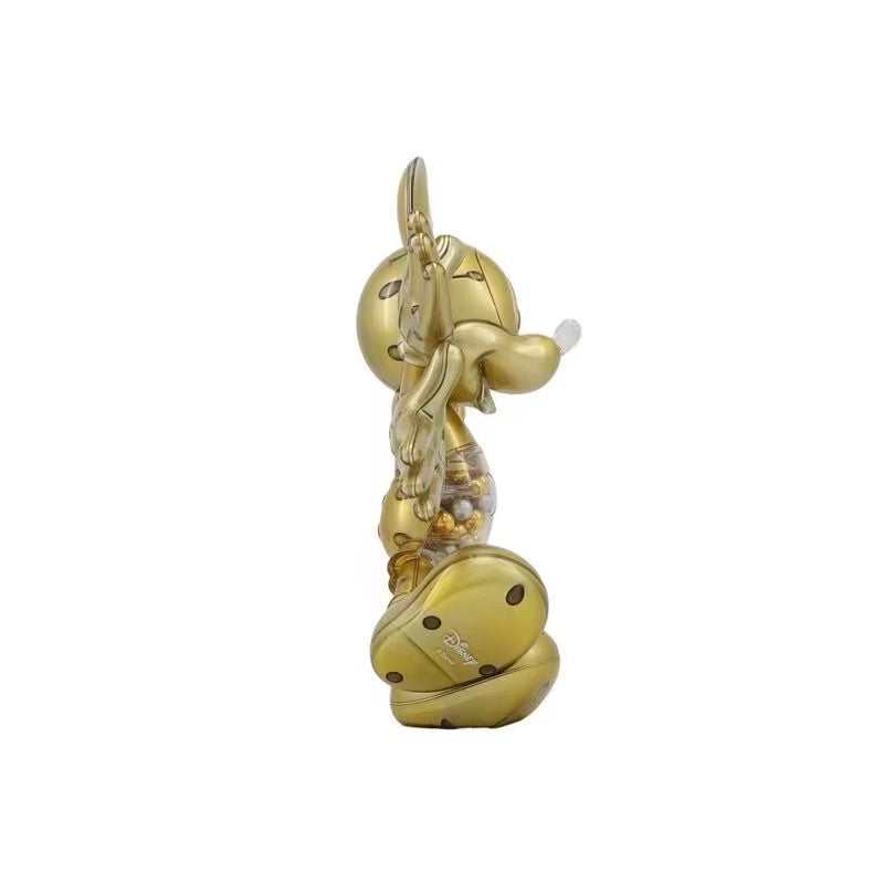 Side view of the Snow Angel Mickey Sculpture highlighting the golden spherical base filled with clear and gold-colored beads