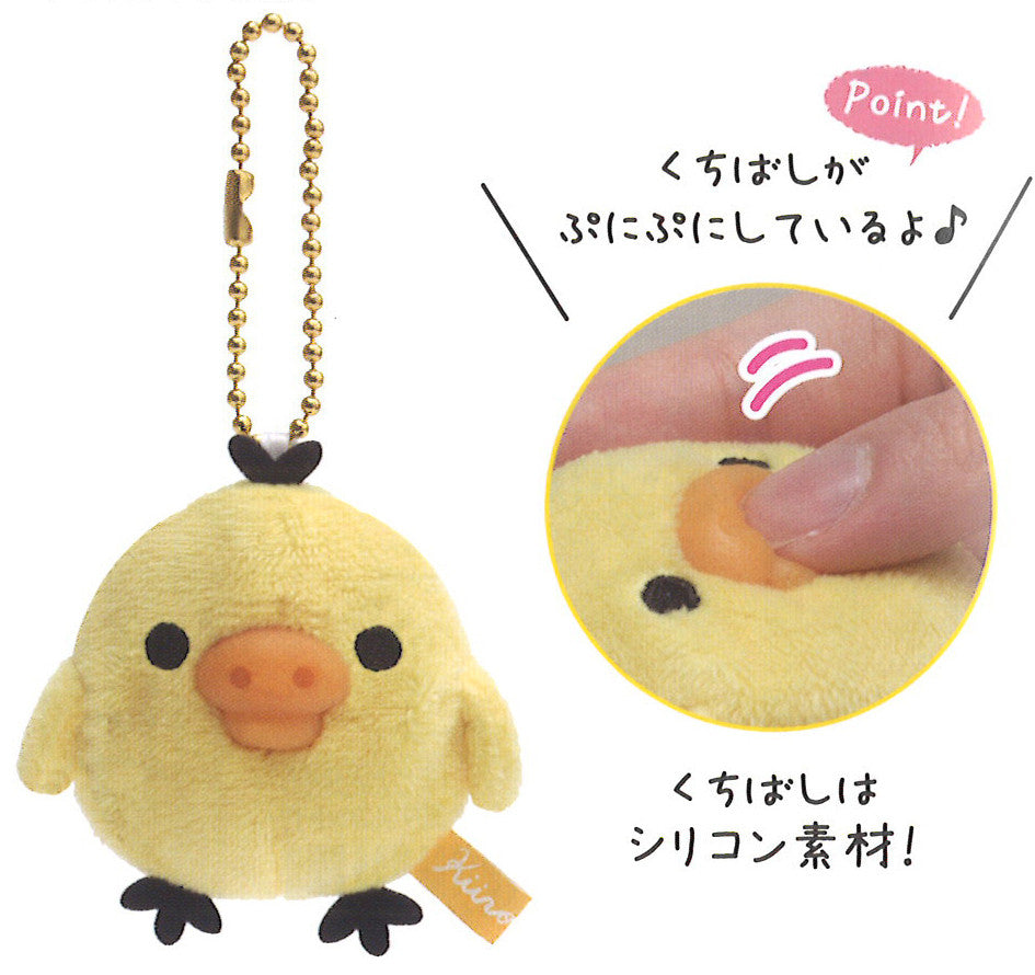 Close up of Soft yellow Kiiroitori plush bird mascot keychain with a gold chain, attached to a card featuring a matching character illustration.