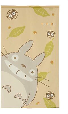 Beige door curtain depicting a large Totoro character with expressive eyes, surrounded by green leaves and small spirited soot sprites.