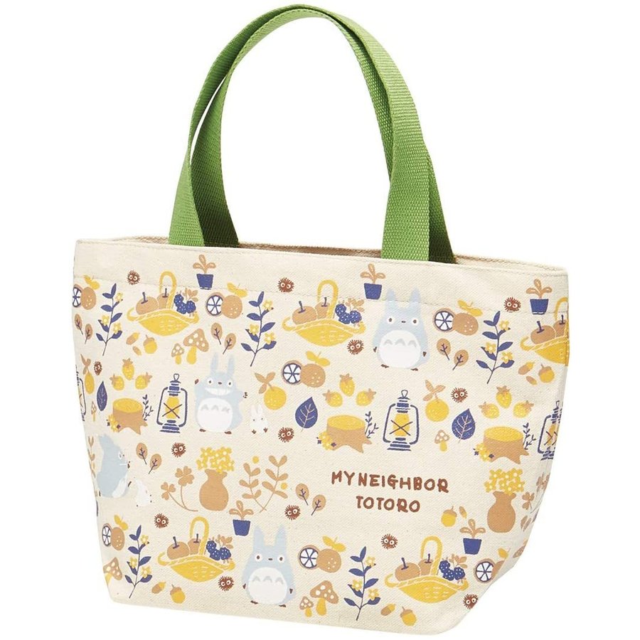 My Neighbor Totoro canvas tote bag with green handles, nature-themed design with Totoro and picnic icons.